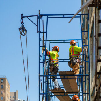 Construction workers at work on a skyscraper building