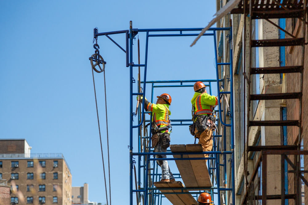 Construction workers at work on a skyscraper building