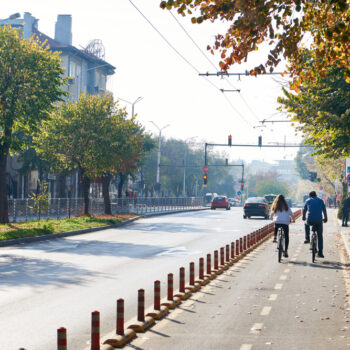 Cyclists on bike path in city