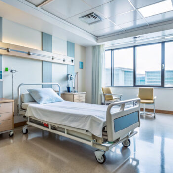 empty hospital ward with vacant bed